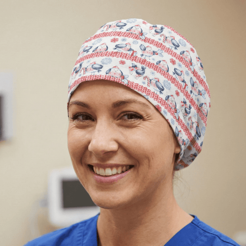 Christmas Fat Birds Snow Jumper scrub cap shown on model