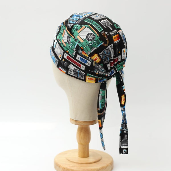 Medicus Scrub Cap with a circuit board and computer-themed pattern, featuring AI and tech-inspired designs on a black background.