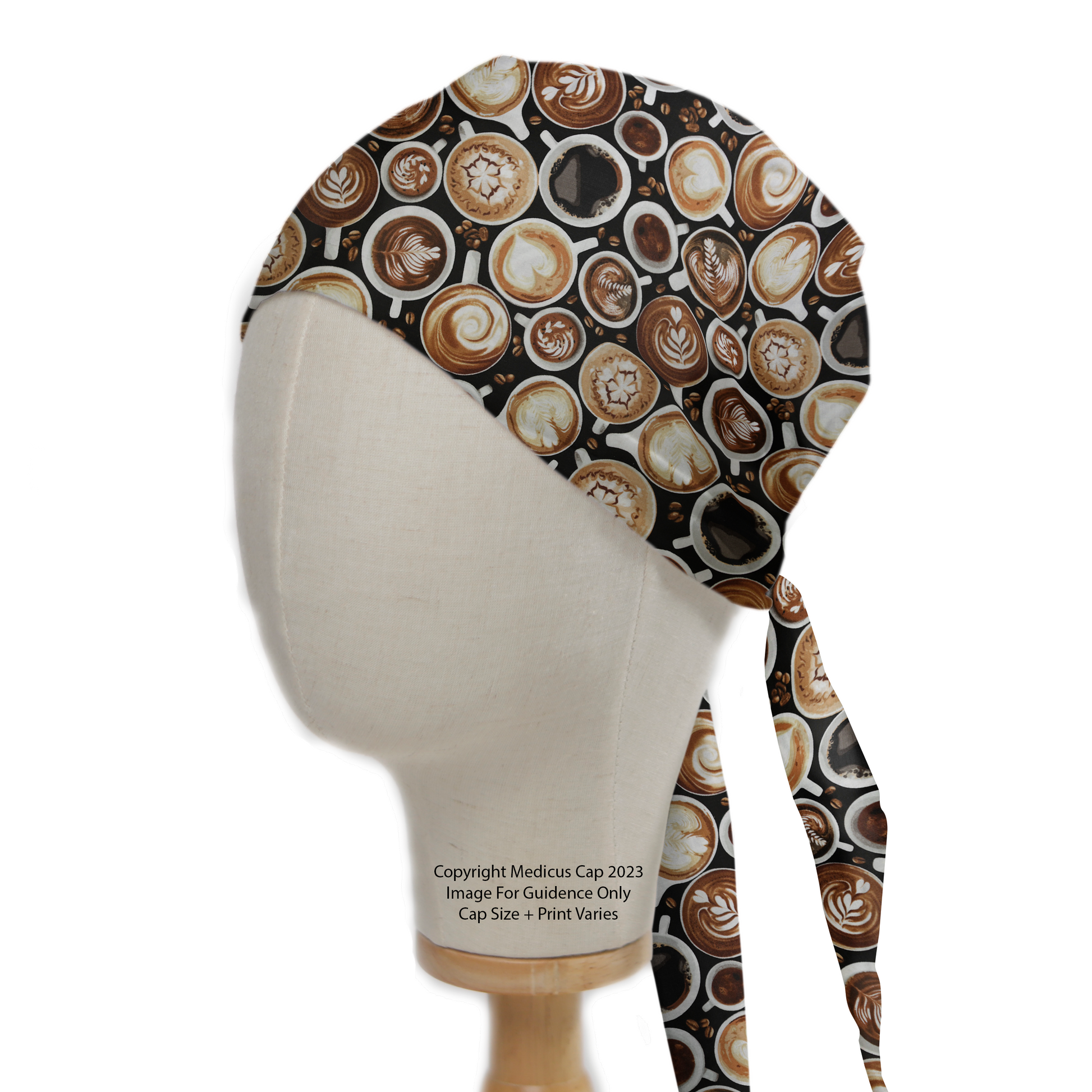 The Coffee Runs My Brain Scrub Cap by Medicus Scrub Caps showcases a coffee-themed design with latte art, blending brown and cream hues on a dark background.