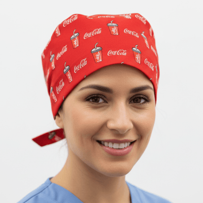 Red Coca Cola logo pattern scrub cap with tie-back closure on smiling healthcare worker