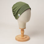 Contour stretch scrub cap in olive, front right view