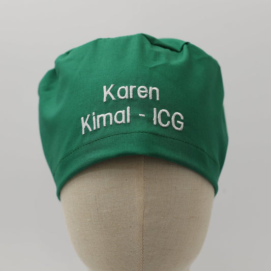 Custom Surgical Cap With Name And Role on an emerald plain fabric from medicus caps