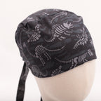 Dinosaur Bones Cartoon Dark scrub cap pattern detail on mannequin