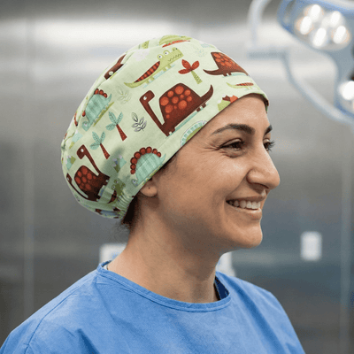 Dinosaurs in a Swamp Green scrub cap shown on model