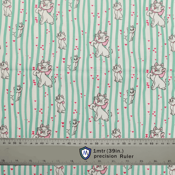Fabric sample for Medicus Scrub Caps featuring Disney Marie Cat print with green stripes and hearts, shown with a ruler for scale.