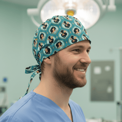 Disney Aladdin Jasmine Heads scrub cap shown on model