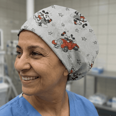 Disney Mickey and Minnie Mouse Adventure scrub cap shown on model