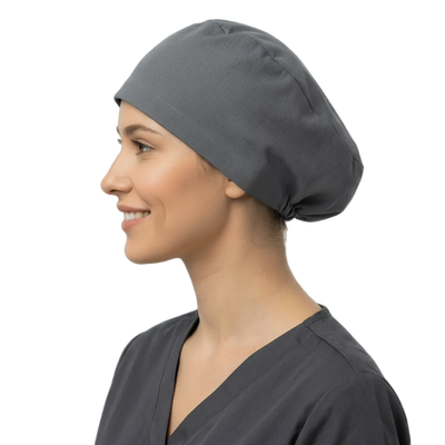 Charcoal grey elastic back scrub cap worn by smiling healthcare professional