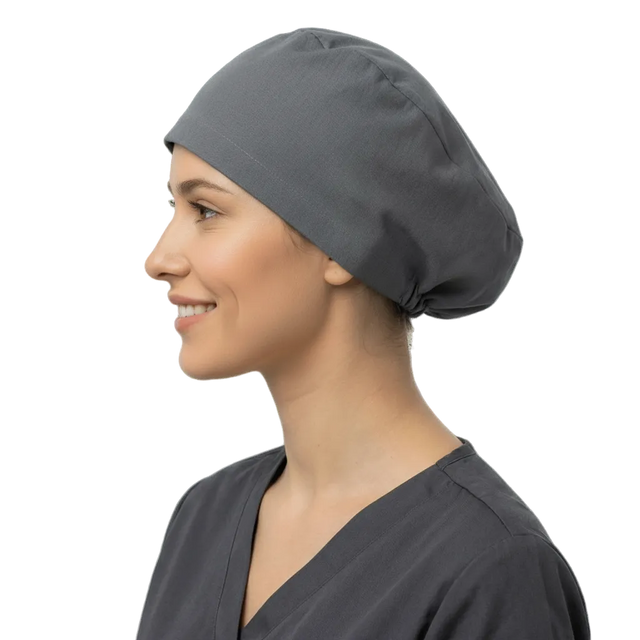 Charcoal grey elastic back scrub cap worn by smiling healthcare professional