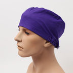 Purple solid colored Duchess scrub cap shown in side profile view on mannequin head