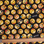 Pattern of various emoji icons on a black background with a ruler at the bottom.