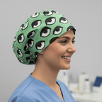 Eyes Teal scrub cap shown on model