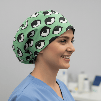 Eyes Teal scrub cap shown on model