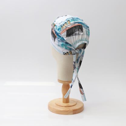 Grey’s Anatomy-inspired Medicus scrub cap featuring a ferry boat design, displayed on a mannequin. Stylish and functional for medical professionals.