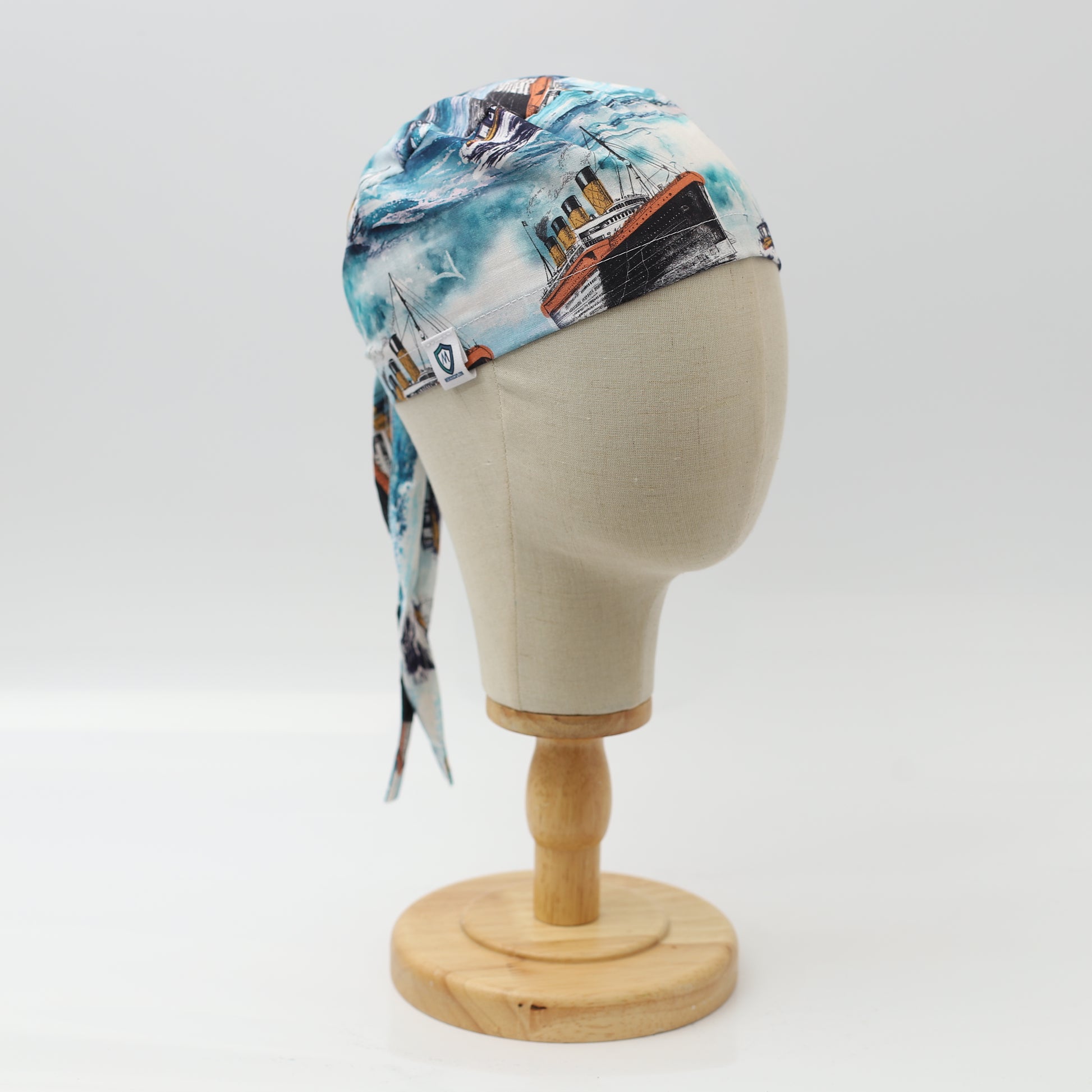 Greys Anatomy-inspired Medicus scrub cap featuring ferry-boat design, displayed on a mannequin head. Stylish and functional headwear for medical professionals.