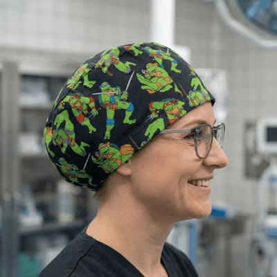 Fighting TMNT Teenage Mutant Ninja Turtles on black scrub cap