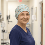 Floral On Teal scrub cap shown on model