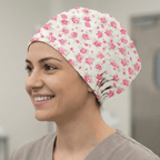 Floral Pink On Ivory scrub cap shown on model