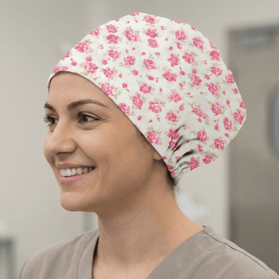 Floral Pink On Ivory scrub cap shown on model