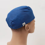 Blue Crown scrub cap back view showing gathered elastic design and white brand label