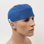 Side profile view of royal blue Crown scrub cap on mannequin head