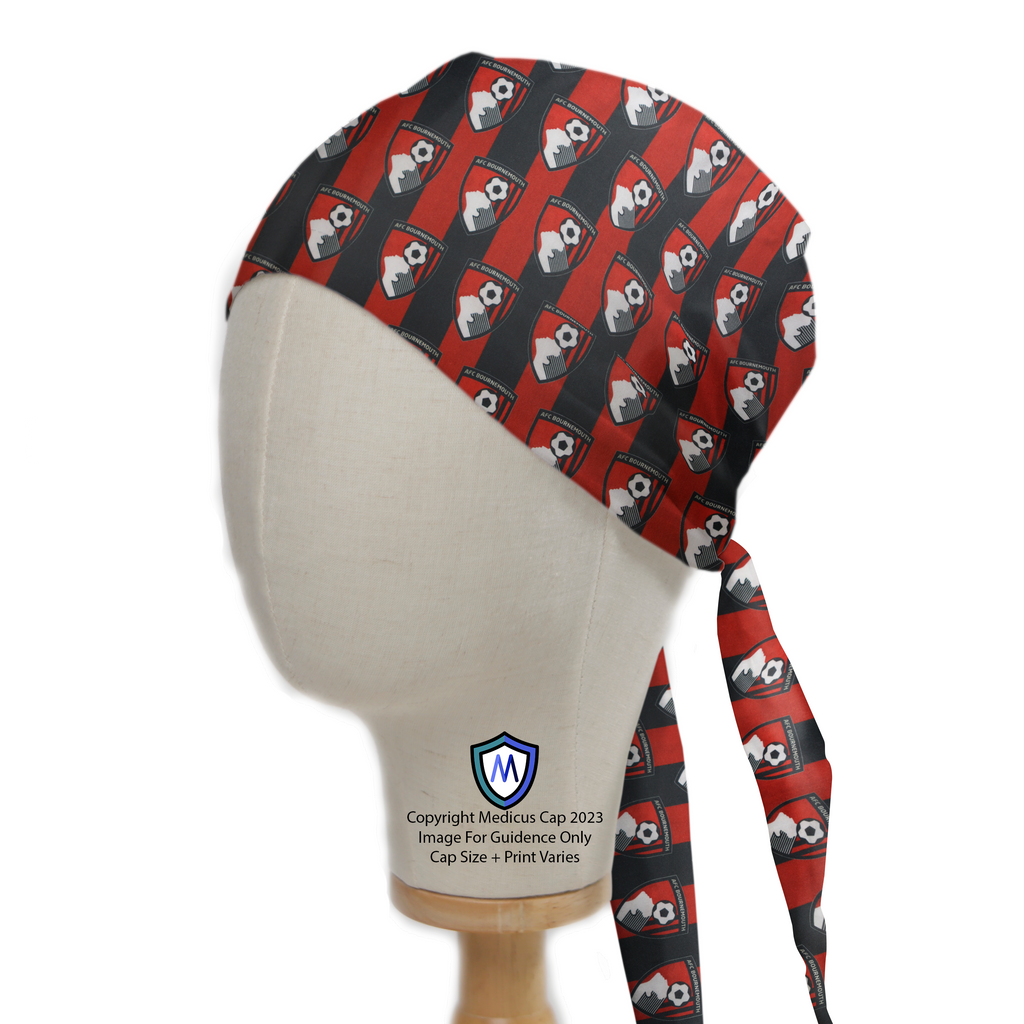 A mannequin head wearing a Medicus Scrub Cap with a red and black AFC Bournemouth football club pattern. The cap has a tie at the back.