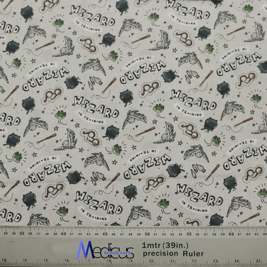 Close-up of Harry Potter Wizard In Training fabric for Medicus Scrub Caps, featuring wands, owls, cauldrons, and text, perfect for wizarding fans.