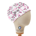 Elastic-backed scrub cap featuring Hello Kitty in a pink rose garden pattern on white background, shown on mannequin side view.