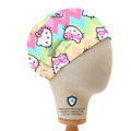 Elastic-backed scrub cap featuring Hello Kitty on pastel rainbow zigzag pattern with chevron stripes, shown on mannequin side view.