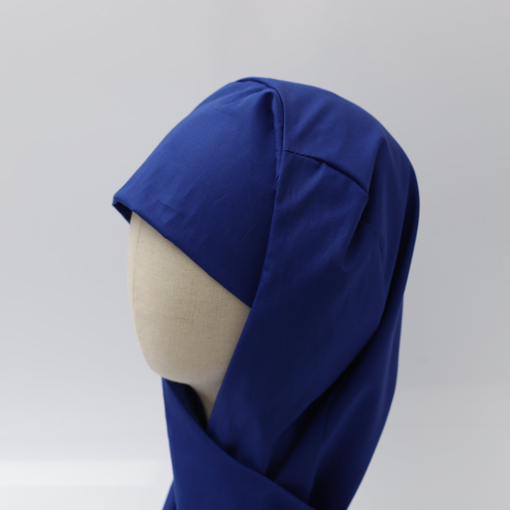 Blue Medicus hijab scrub cap, reusable theatre hat with full coverage, displayed on a mannequin against a neutral background.