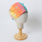 90s Stars Rainbow scrub cap shown on mannequin head