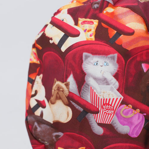 Cats At The Cinema scrub cap pattern detail on mannequin