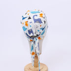 Dinosaurs Purple Blue Orange scrub cap shown from side angle