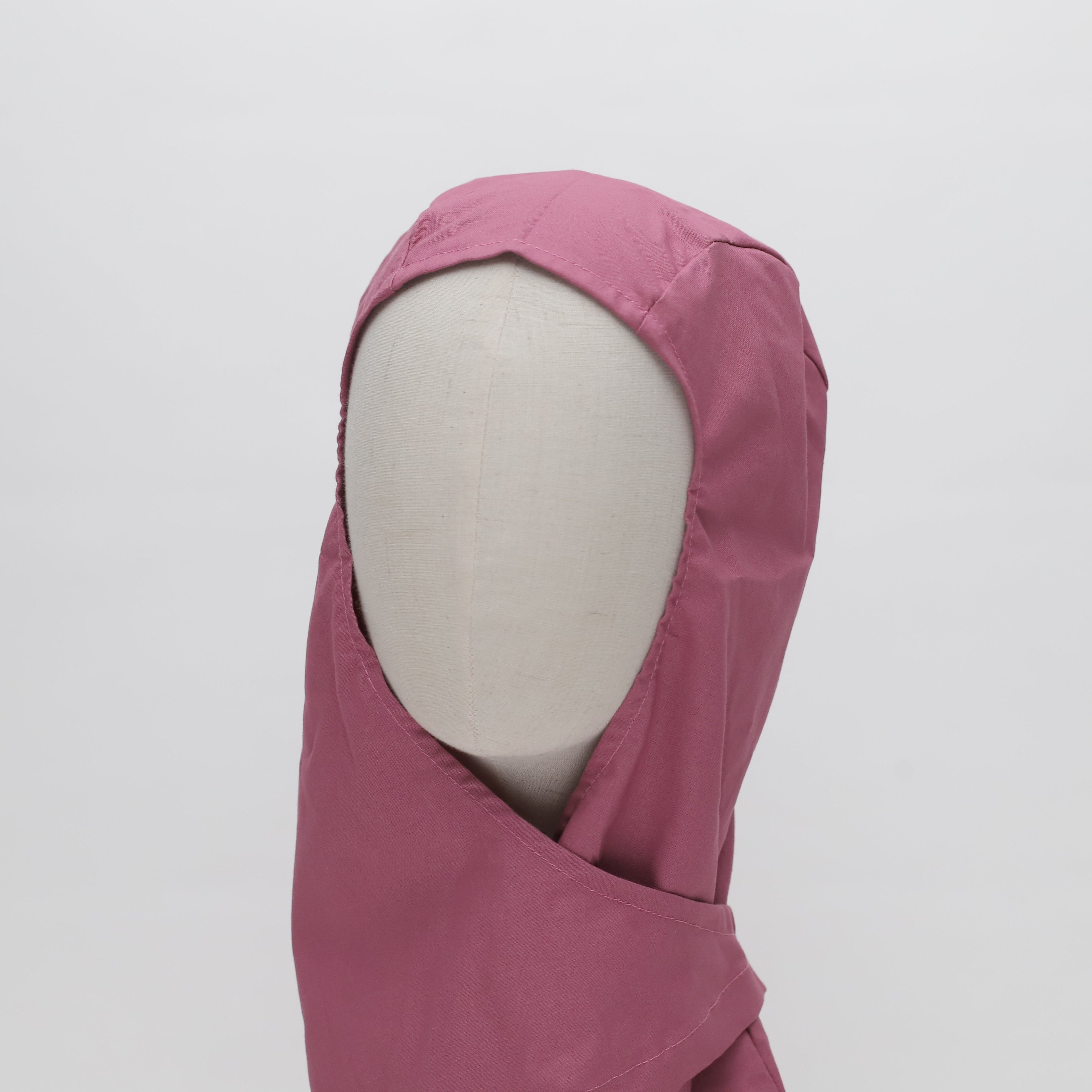 A faceless mannequin wears the Medicus Scrub Caps Orthopaedic Surgical Hood Scrub Cap in pink, showcasing its protective design and durable fabric against a white background.