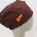 Brown scrub cap with orange smiley pancreas design shown on mannequin head side view