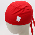 Red scrub cap with white sparkle tooth design shown on mannequin head, side view