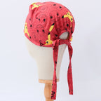 Back view of red Pokemon scrub cap with Pikachu characters on wooden mannequin head