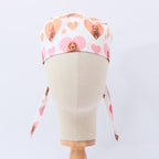Cocker Spaniel Dogs Hearts White scrub cap shown on mannequin head