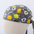 Close-up back view of gray Star Wars scrub cap featuring cute Yoda, R2-D2, C-3PO character heads with stars