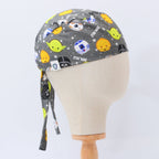 Side view of gray scrub cap featuring colorful kawaii Star Wars character heads including Yoda and R2-D2