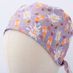 Purple scrub cap with orange pumpkins and "Pumpkin Spice Propofol" text shown from side profile