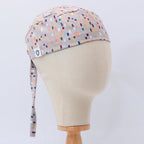 Abstract Crowd scrub cap pattern detail on mannequin