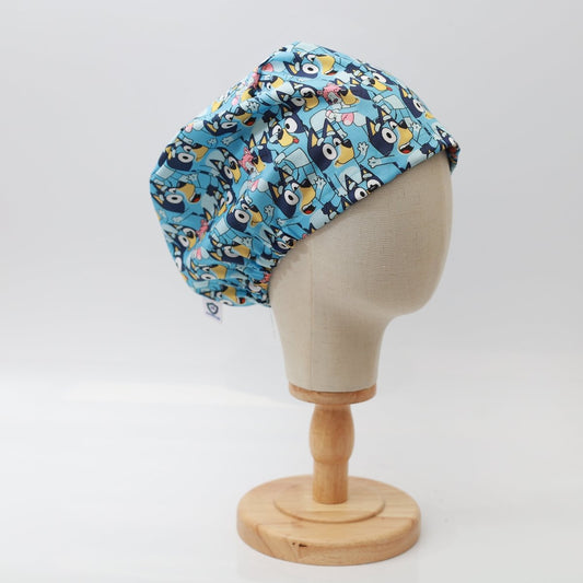 Medicus Scrub Cap featuring a vibrant Bluey-themed pattern, displayed on a mannequin head. Comfortable and stylish for medical professionals.