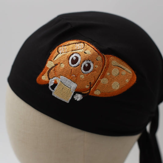 Black Medicus Scrub Cap with embroidered cartoon liver holding a beer, featuring a spotted design and playful expression.