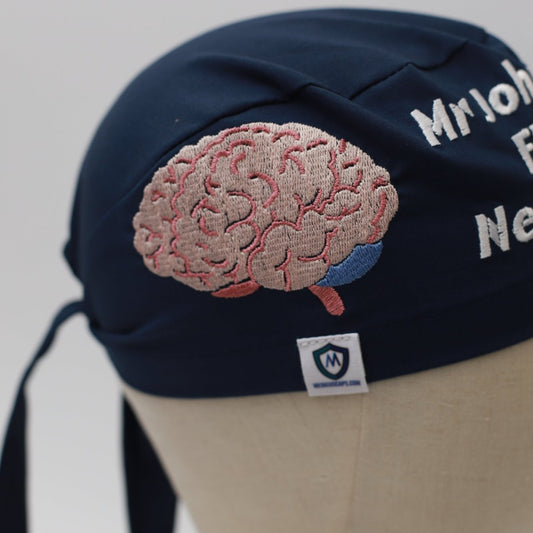 The Medicus Scrub Caps Embroidery - Brain Scrub Cap in navy blue features an embroidered brain design and text, ideal for medical professionals.