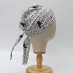 Side view of white scrub cap with black Star Wars character pattern on wooden display head