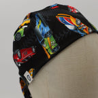 Side view of racing cars motorsport scrub cap showing colorful race car pattern on black fabric