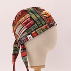 Side profile view of Old Book Library scrub cap featuring colorful vintage book spines pattern
