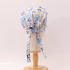 Charlie Brown + Friends In Grid scrub cap shown on mannequin head