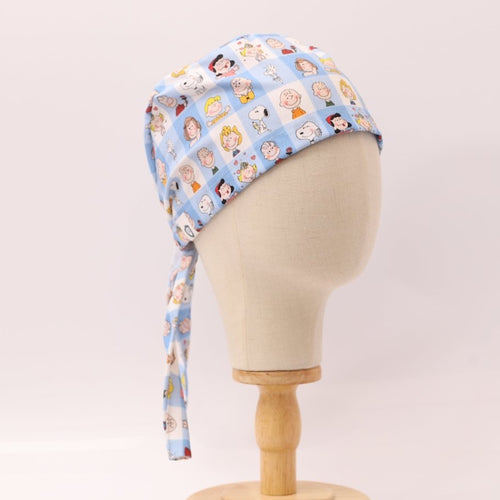 Charlie Brown + Friends In Grid scrub cap pattern detail on mannequin